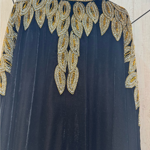 Luxurious Black and Gold Maxi Dress with Intricate Embellishments - Picture 3 of 6